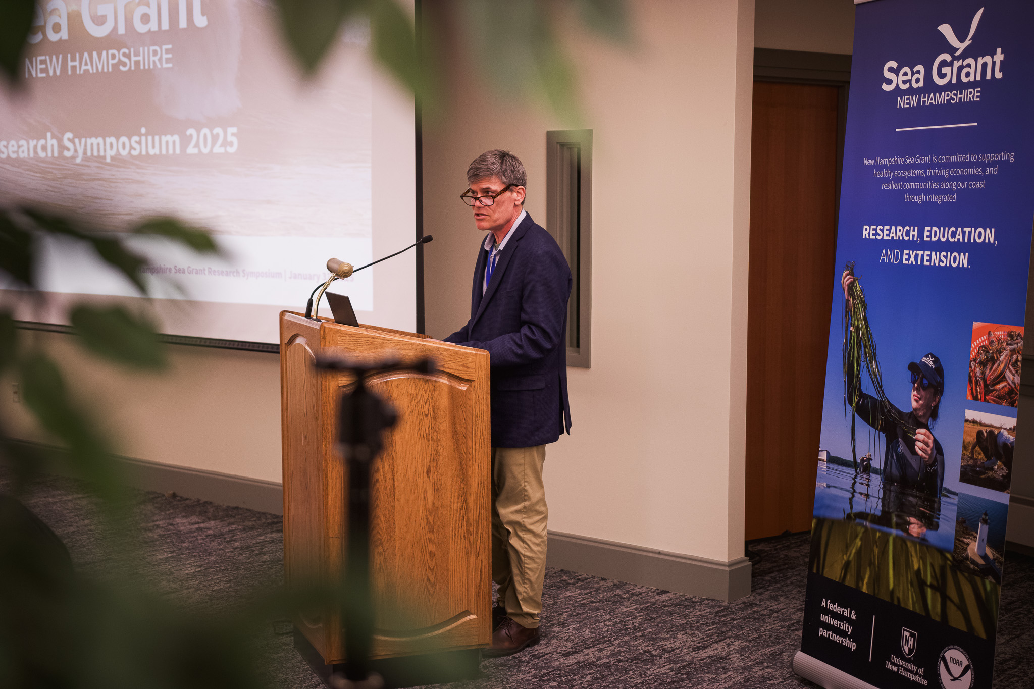 Dr. Erik Chapman, New Hampshire Sea Grant's director, gives opening remarks at the Research Symposium. 