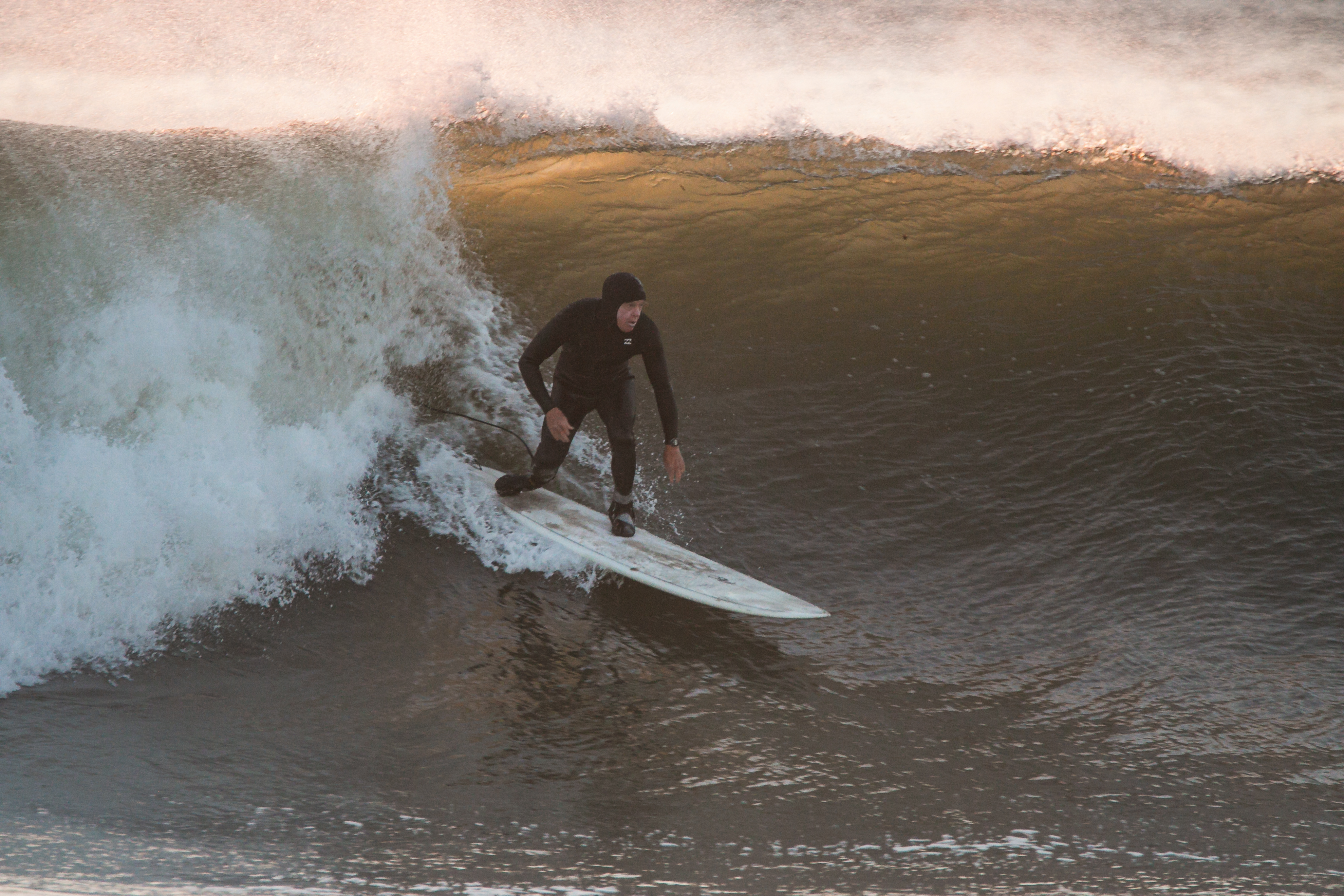 A surfer rides a big wave in New Hampshire.