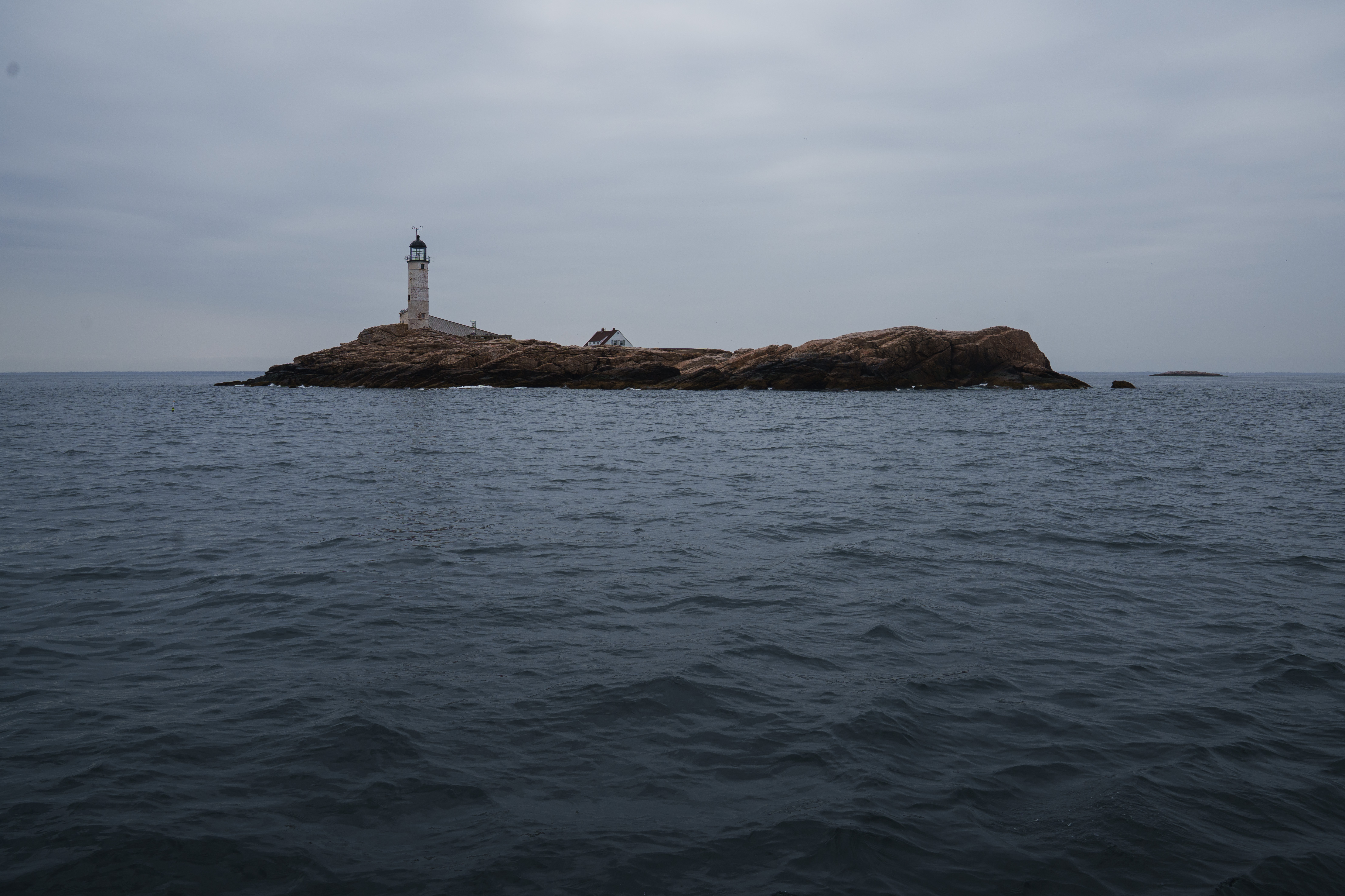 A view of white island lighthouse from the open ocean.