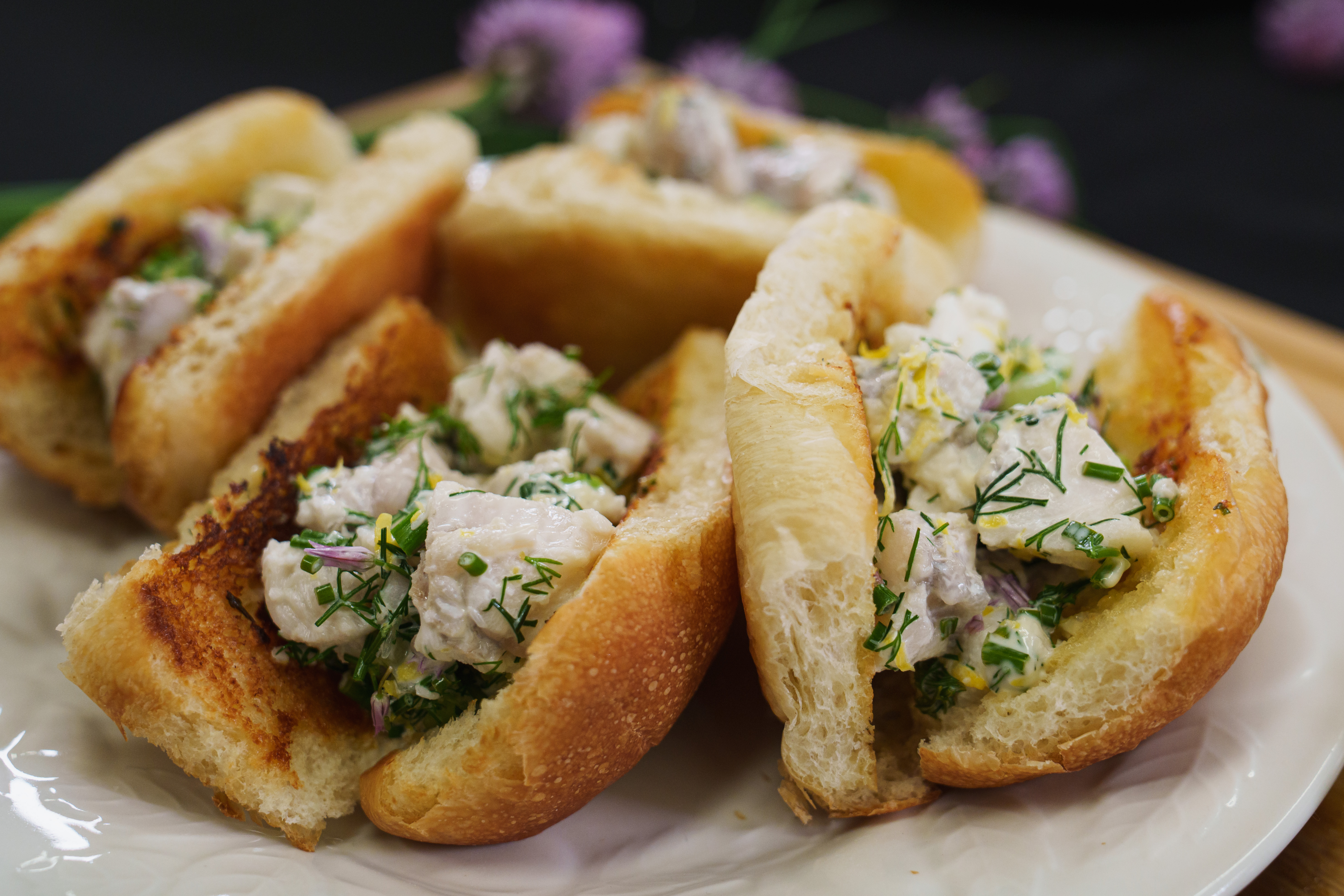 A plate of monkfish rolls, ready to eat.