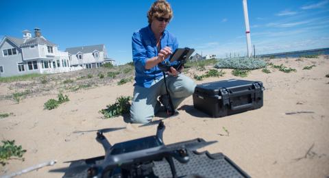 researcher at tidal marsh