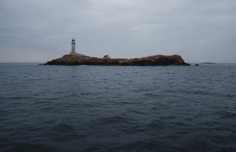 A view of white island lighthouse from the open ocean.