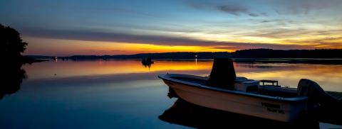 boat on water at sunset