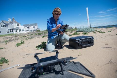 Gregg Moore sets up drone on the beach