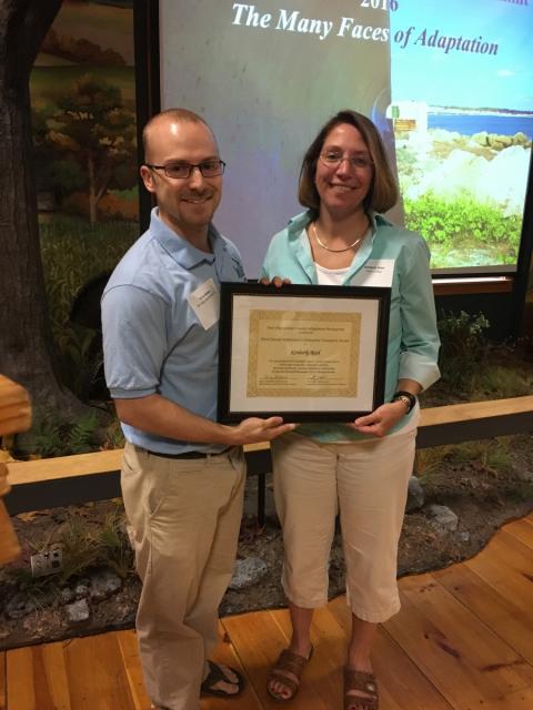 Kim Reed receives the award