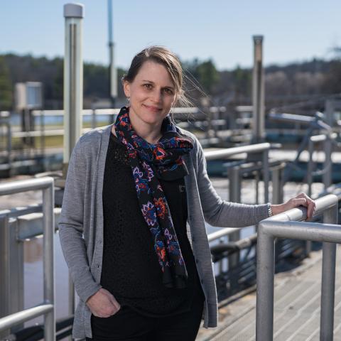 Paula Mouser posing for a photo at a Wastewater Treatment Plant.