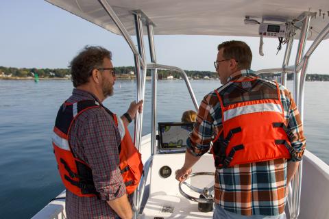 Michael Doherty (right), Aquaculture Education Project Manager at New Hampshire Sea Grant, leads a group visiting the Coastal Marine Lab in New Castle, NH. 