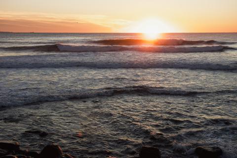 Waves breaking at sunrise along the New Hampshire coastline.