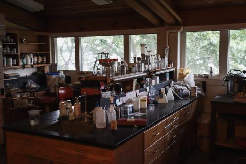 A lab table with equipment scattered about.