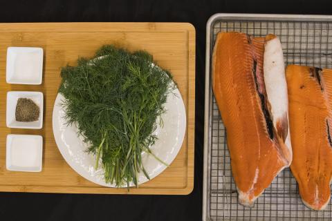 A filet of fish on a cutting board.